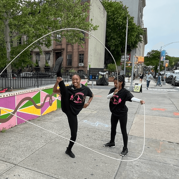 Two young women doing double dutch